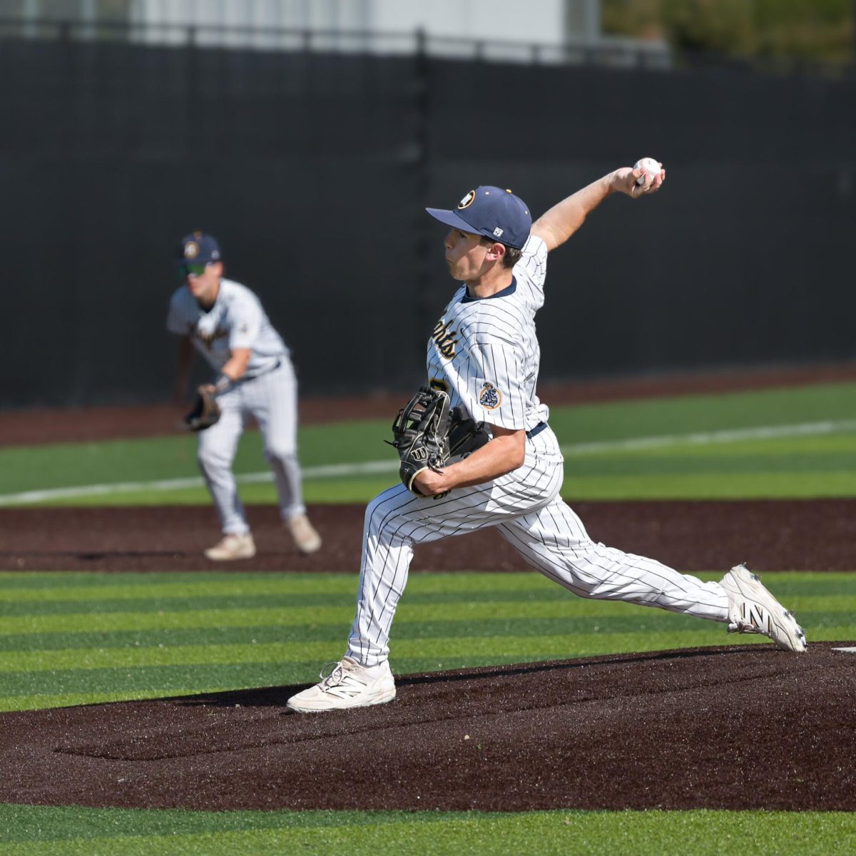 Junior Jackson Flanagan delivers a pitch during a dominant performance on the mound.